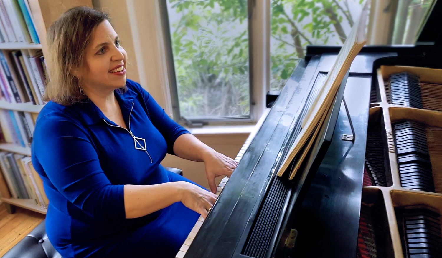 Margy practicing at the piano.